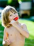 boy eating a popsicle