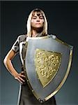 businesswoman holding a shield