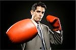 businessman wearing boxing gloves