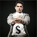 businessman holding a bag of money