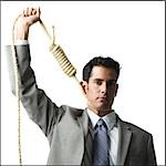 businessman with hangman's noose around his neck