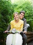 young couple on a classic motor scooter