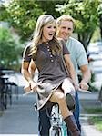 young couple riding a bike