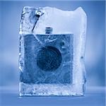 whiskey flask frozen in a block of ice