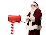 santa getting mail out of his mailbox