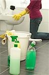 Woman cleaning toilet