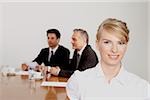 Three businesspeople in conference room, Bavaria, Germany