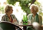 Two senior women in outdoor cafe