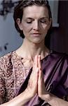 Darkhaired Woman in a Saree has her Hands folded - Tradition - Supplication