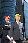 Two businessman wearing hardhats