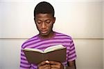 Young man reading a book