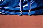 Woman standing in front of a safety mat