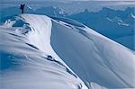 Extreme skier stands on ridge atop Mt.Spur Kenai Mountains Kenai Peninsula Alaska Winter