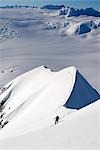 Skier climbing up ridge above the Sargent Icefield Southcentral Alaska Spring