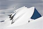 Skier climbing up ridge above the Sargent Icefield Southcentral Alaska Spring