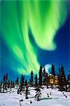 Aurora over cabin in the White Mountain recreation area during Winter in Interior Alaska