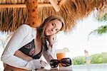 Portrait of Woman in Tiki Hut, Florida, USA