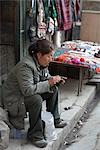 Woman Handmaking Items for Sale, McLeod Ganj, Himachal Pradesh, India