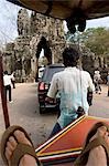 Rickshaw and car by Bayon Temple,Angkor,Siem Reap,Cambodia