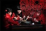 Chinese girls eating with chopsticks in Pingyao,a UNESCO World Heritage Site,Shanxi,China