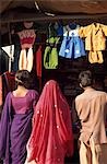 People looking at children's clothing stall,Chirawa,Shekhawati,Rajasthan,India.