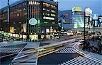 Early evening at busy intersection Sukiyabashi Crossing in the popular shopping Ginza area  Tokyo,Japan