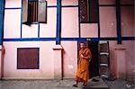 Monk leaving building,Laos