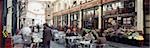 People having lunch at streetside café,Leadenhall market,London,UK