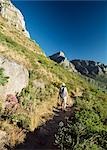 Walker on path down from Lion's head,Camps Bay and Twelve Apostles,Cape Town,South Africa