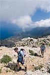 Two men hiking along mountain trail,elevated view,Majorca,Balearic Islands,Spain,track built by Archduke Ludwig Salvador