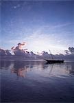 Dhow in calm waters at low tide at dawn,Matemwe beach,Zanzibar,Tanzania.