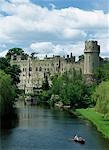 Family boating beneath Warwick Castle,Warwick,England,UK