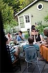 People eating dinner in back yard,Hudson Valley,New York State,USA