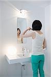 Japanese woman brushing her teeth