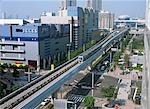 Train going through commercial sector, Tokyo, Japan