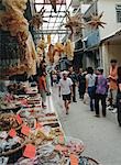 Tourists shop at Taio O village