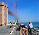 Cyclists meeting at Fort Point National Historical Site, Golden Gate Bridge, San Francisco