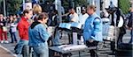 Tourists enjoying the street band at Fisherman's Wharf, San Francisco