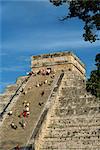 Tourists climbing El Castillo, pyramid dedicated to the god Kukulcan, Chichen Itza, UNESCO World Heritage Site, Yucatan, Mexico, North America