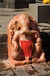 Outdoor Hindu shrine to Ganesh, the elephant god, on the ghats below Ahilya Fort, Maheshwar, Madhya Pradesh state, India, Asia