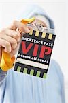 Woman Holding a VIP Pass