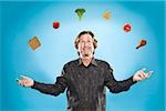 Man juggling different foods