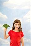 Child holding broccoli