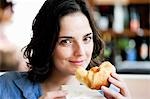 Woman Eating Croissant