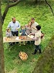 People eating applecake with basket