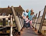 mature couple with children on walkway