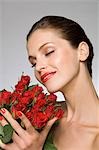 Female beauty model smelling roses