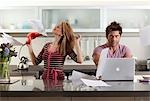 woman drying hair next to partner