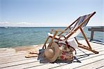 Chair, Hat, Flip Flops and Bag on Dock