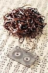 Unravelled Cassette Tape on Sheet Music